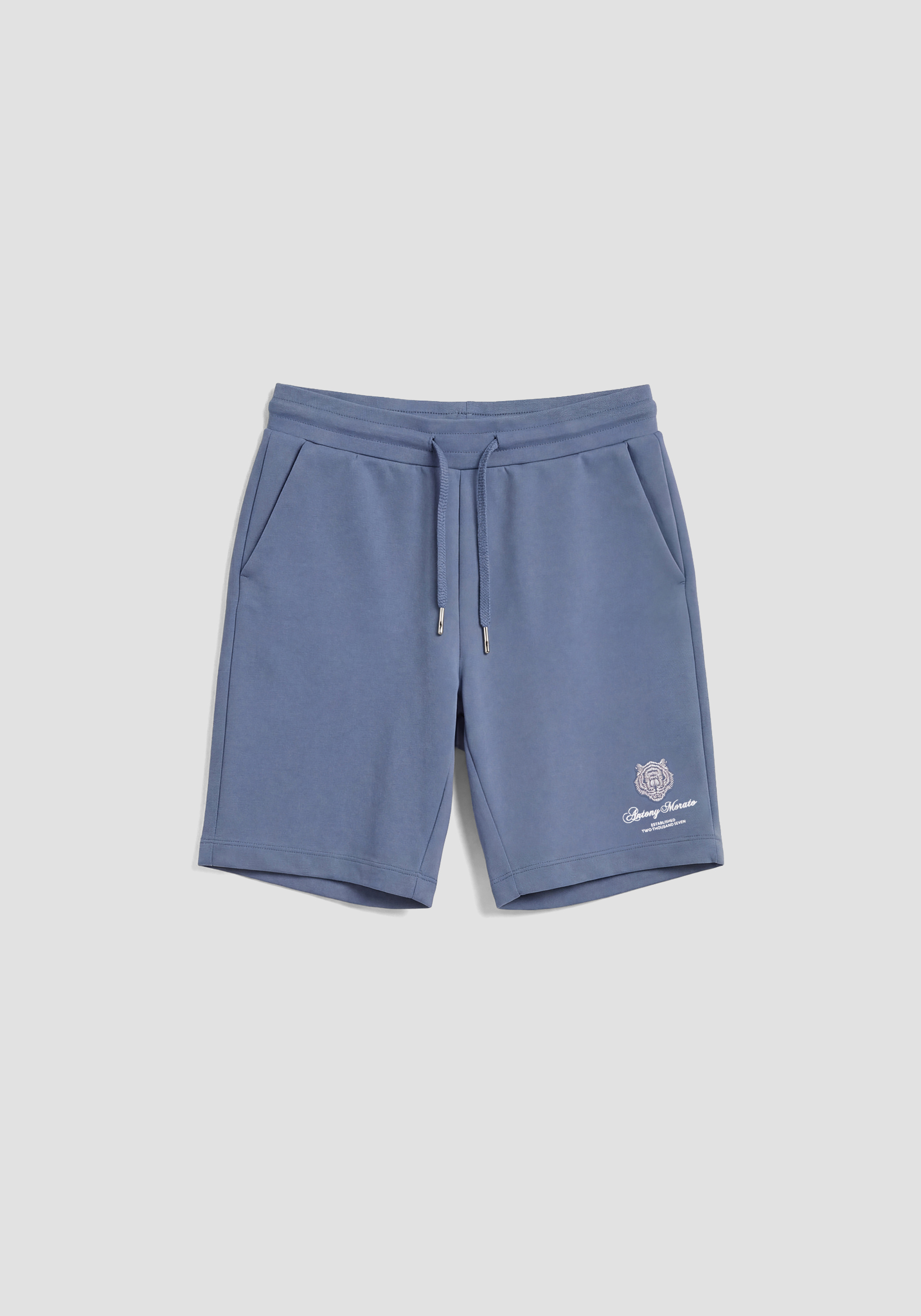 PANTALONES CORTOS DE CORTE REGULAR CON ELÁSTICO Y ESTAMPADO DE TIGRE